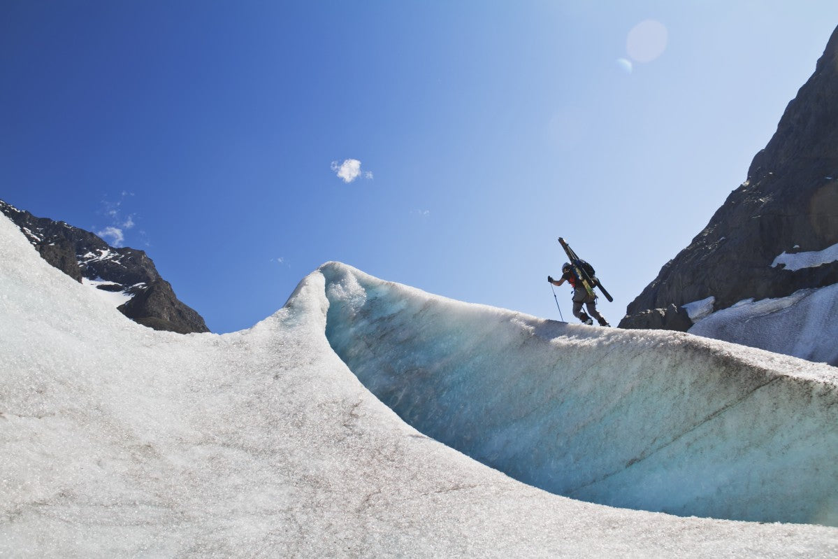 Backcountry skier above the Eklutna Glacier, Western Chugach Mountains, Southcentral Alaska, Winter - Powderaddicts