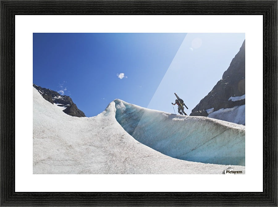 Backcountry skier above the Eklutna Glacier, Western Chugach Mountains, Southcentral Alaska, Winter - Powderaddicts